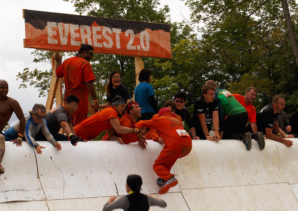 Michael pulling Eric over an obstacle