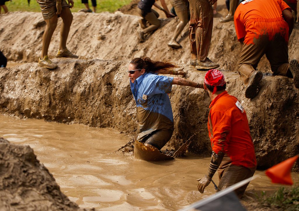 Tammy leaping into the mud