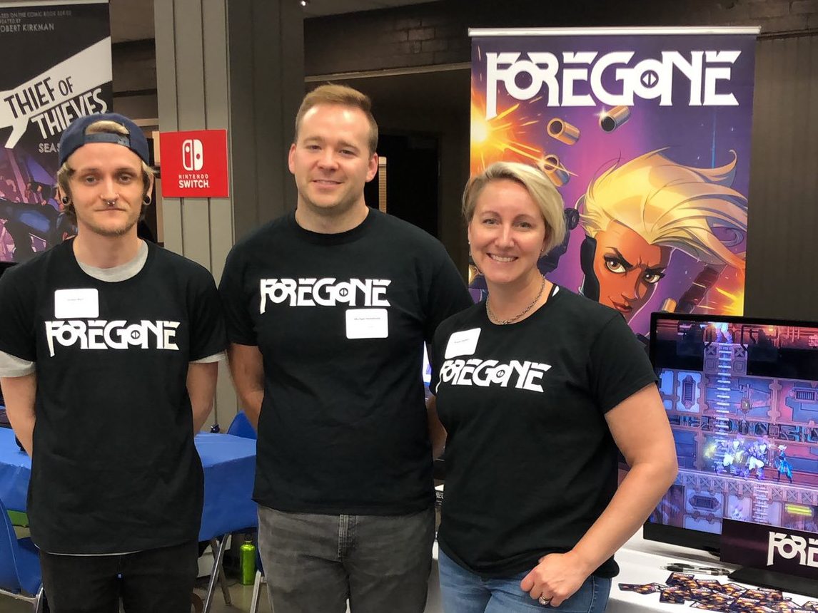 Jordan, Mike, and Karen from the Foregone team manning the Foregone booth at Game Slice 2019